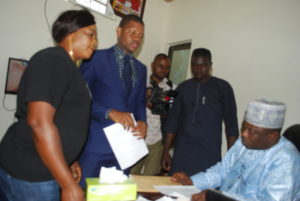 SEC 1: left to right: Zonal Head Securities and Exchange Commission Kano Zonal Office, Mr. Danladi Mohammed, Managing Director, Dantata Success and Profitable Company, Kano, Alhaji Lawan Sani and DSP Mukthar Hussaini Aliyu of the SEC Police Unit during the Enforcement action on Dantata Success and Profitable Company, Kano, Wednesday.