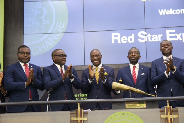 R – L shows Oscar N. Onyema, OON, Chief Executive Officer, The Nigerian Stock Exchange (NSE) presenting a replica of the closing gong to Dr. Sola Obabori, Group Managing Director/CEO, Red Star Express Plc during the Facts Behind the Figures presentation at the Exchange today in Lagos