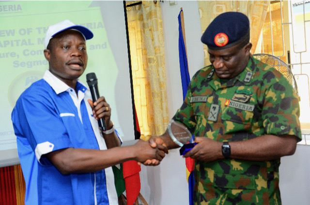 Pix 1&2, Left to Right: Head Lagos Zonal office of the Securities and Exchange Commussion, SEC, Mr. Stephen Falomo, presenting a plaque to Major General Ayobami Ibikunle, Commandant, Nigerian Army Ordinance School, Ojo, during an enlightenment campaign by the SEC at Nigerian Army Ordinance School, Ojo, Lagos.