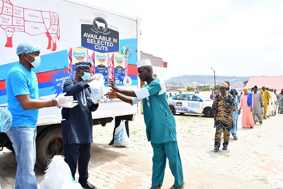 > A & B: National Sales Manager, Natnudo Foods, Mr Yomi Gbadamosi (left); President General, Central Council of Ibadan Indigenes, Chief Yemi Soladoye (second left) presenting frozen chickens to people of Ibadan as Covid-19 relief to 500 peoples by Natnudo Foods Limited held at Ibadan House.