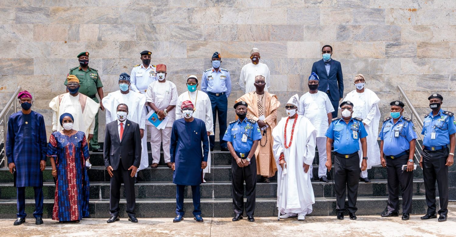 Lagos State Governor, Mr. Babajide Sanwo-Olu (fourth left); representative of IGP, Assistant Inspector General of Police (AIG), Training & Development, Force Headquarters, Mr. David Folawiyo (middle); Oba of Lagos & Co-Chairman, State Community Policing Advisory Committee (SCPAC), Oba Rilwan Akiolu I (fourth right); State Commissioner of Police & Co-Chairman of SCPAC, Mr. Hakeem Odumosu (right); Deputy Governor, Dr. Obafemi Hamzat (third left); Secretary to the Lagos State Government, Mrs. Folasade Jaji (second left); Chief of Staff to the Governor, Mr. Tayo Ayinde (left) and others, during the inauguration of SCPAC and the State Community Policing Committee (SCPC), at Lagos House, Alausa, Ikeja, on Wednesday, June 3, 2020.