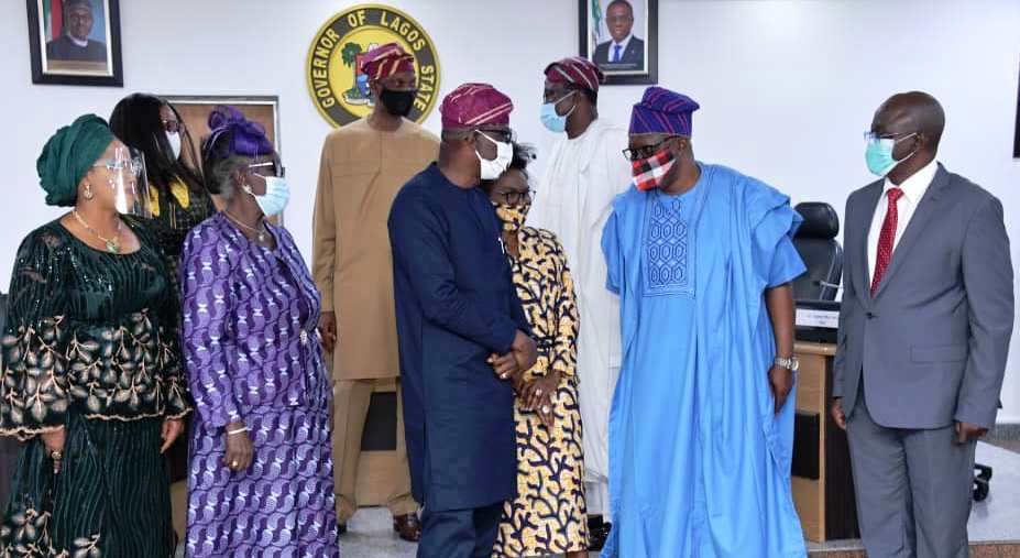 Lagos State Governor, Mr. Babajide Sanwo-Olu (right), presents Oath of Office to the Chairman of Audit Service Commission, Mrs. Oluwatoyin Adegbuji-Onikoyi, during the swearing-in of the Commission members at EXCO chamber, Lagos House, Alausa, Ikeja, on Tuesday, July 28, 2020.