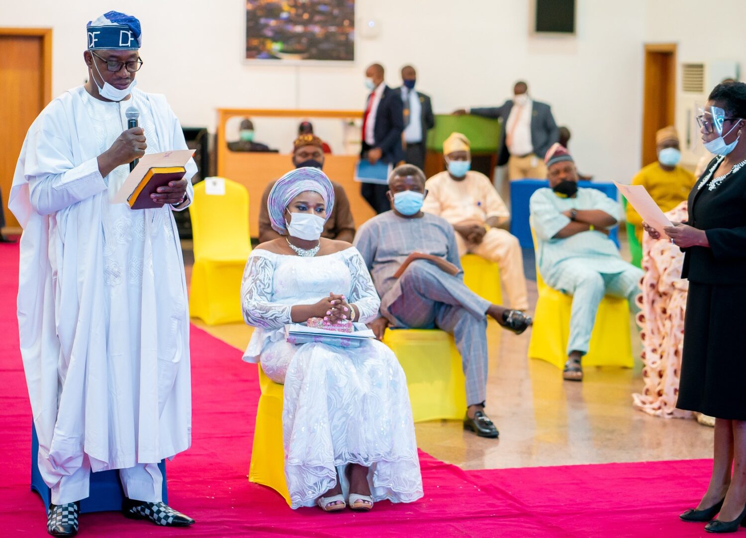 New Chairman of Agbado-Oke Odo LCDA, Mr. David Famuyiwa (left), taking his Oath of Office, presided over by Lagos State Governor, Mr. Babajide Sanwo-Olu, at Lagos House, Alausa, Ikeja, on Tuesday, June 30, 2020. Seated by him is his wife, Abiodun.